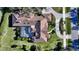 Bird's-eye view of a home with a pool and a long driveway at 7419 Albert Tillinghast Dr, Sarasota, FL 34240