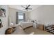 Cozy bedroom with ample natural light and wood floors at 7419 Albert Tillinghast Dr, Sarasota, FL 34240