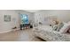 Charming bedroom with floral bedding and built-in workspace at 7419 Albert Tillinghast Dr, Sarasota, FL 34240
