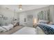 Bedroom with two twin beds and a hanging chair at 7419 Albert Tillinghast Dr, Sarasota, FL 34240