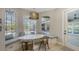 Kitchen breakfast nook with built-in seating and view of pool at 7419 Albert Tillinghast Dr, Sarasota, FL 34240