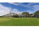 Spacious clubhouse with large windows overlooking the golf course at 7419 Albert Tillinghast Dr, Sarasota, FL 34240