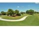 A gently curving path meanders through the golf course at 7419 Albert Tillinghast Dr, Sarasota, FL 34240