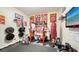 Home gym with various equipment including a weight rack and rowing machine at 7419 Albert Tillinghast Dr, Sarasota, FL 34240
