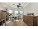 Bright home office features built-in shelving and large windows at 7419 Albert Tillinghast Dr, Sarasota, FL 34240