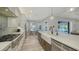 Modern kitchen with farmhouse sink and breakfast area at 7419 Albert Tillinghast Dr, Sarasota, FL 34240