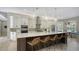 Spacious kitchen with island, white cabinets, and stainless steel appliances at 7419 Albert Tillinghast Dr, Sarasota, FL 34240