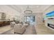 Open floor plan with kitchen island and living area at 7419 Albert Tillinghast Dr, Sarasota, FL 34240