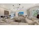 Living room with shiplap wall and comfortable seating at 7419 Albert Tillinghast Dr, Sarasota, FL 34240
