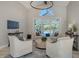 Relaxing living room with circular seating and pool access at 7419 Albert Tillinghast Dr, Sarasota, FL 34240