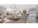 L shaped living room with access to pool area at 7419 Albert Tillinghast Dr, Sarasota, FL 34240