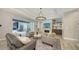 Spacious living room with fireplace and access to backyard at 7419 Albert Tillinghast Dr, Sarasota, FL 34240