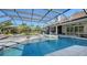 Stunning pool and spa with screened enclosure and spacious patio at 7419 Albert Tillinghast Dr, Sarasota, FL 34240
