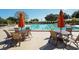 Community pool with plenty of lounge chairs and umbrellas at 7419 Albert Tillinghast Dr, Sarasota, FL 34240