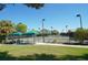 Enjoy resort-style tennis with shaded seating areas at 7419 Albert Tillinghast Dr, Sarasota, FL 34240