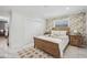 Light and airy bedroom with wood bed frame and neutral decor at 8135 Longbay Blvd, Sarasota, FL 34243