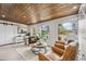 Bright Gathering room features wood ceiling and leather chairs at 8135 Longbay Blvd, Sarasota, FL 34243