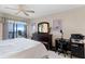 King-size bed, desk, and water views at 826 Bahia Del Sol Dr # 55, Ruskin, FL 33570