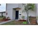 Condo exterior with a front entrance, landscaping, and walkway at 1007 Longfellow Cir, Sarasota, FL 34243
