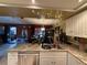 Kitchen features granite countertops, white cabinets, and a breakfast bar at 1007 Longfellow Cir, Sarasota, FL 34243