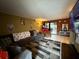 Living room with sectional sofa and large flat-screen TV at 1007 Longfellow Cir, Sarasota, FL 34243