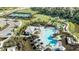 Resort-style pool, tennis courts, and green space at 10518 Eclipse St, Sarasota, FL 34241