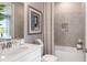 Small bathroom with tub, shower, and white vanity at 10522 Eclipse St, Sarasota, FL 34241