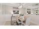 Elegant dining room with a large table, six chairs, and stylish light fixture at 10522 Eclipse St, Sarasota, FL 34241