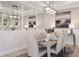 Elegant dining room with a large table, six chairs, and stylish light fixture at 10522 Eclipse St, Sarasota, FL 34241
