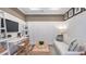 Home office with white board and batten, and a comfy sofa at 10522 Eclipse St, Sarasota, FL 34241