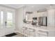 Modern kitchen with a large island and stainless steel appliances at 10522 Eclipse St, Sarasota, FL 34241