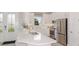 Modern kitchen with white cabinets and stainless steel appliances at 10522 Eclipse St, Sarasota, FL 34241