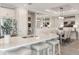 Modern kitchen with a large island, quartz countertops, and stainless steel appliances at 10522 Eclipse St, Sarasota, FL 34241