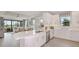 Modern kitchen with white cabinets, quartz countertops, and stainless steel appliances at 10522 Eclipse St, Sarasota, FL 34241