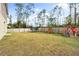 Large backyard with trampoline, playset, and chicken coop at 1379 E Price Blvd, North Port, FL 34288