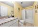 Clean bathroom with granite countertop, tub, and white fixtures at 1379 E Price Blvd, North Port, FL 34288