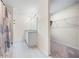 Bathroom with double vanity, granite countertops, and walk-in closet at 1379 E Price Blvd, North Port, FL 34288