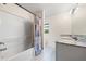 Bathroom with tub, shower, double vanity, and granite countertops at 1379 E Price Blvd, North Port, FL 34288