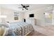 Main bedroom with a king-size bed, dresser, and TV at 1379 E Price Blvd, North Port, FL 34288