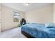 Bedroom with a blue bedspread and plenty of space at 1379 E Price Blvd, North Port, FL 34288