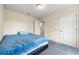 Simple bedroom with a blue bedspread and closet at 1379 E Price Blvd, North Port, FL 34288