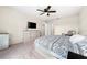 Main bedroom with king bed, dresser, and access to bathroom at 1379 E Price Blvd, North Port, FL 34288