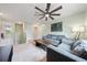 Bonus room with sectional sofa, coffee table, and access to bedrooms at 1379 E Price Blvd, North Port, FL 34288