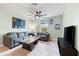 Spacious bonus room with a sofa, coffee table, and TV at 1379 E Price Blvd, North Port, FL 34288