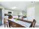 Dining area with view into living room and kitchen at 1379 E Price Blvd, North Port, FL 34288