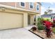 Two-story house with attached garage and red plants at 1379 E Price Blvd, North Port, FL 34288