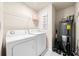 Laundry room with washer, dryer, and storage shelving at 1379 E Price Blvd, North Port, FL 34288