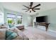 Open-concept living room with gray sectional sofa and hardwood floors at 1379 E Price Blvd, North Port, FL 34288