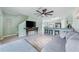 Open-concept living room with gray sectional sofa and kitchen island at 1379 E Price Blvd, North Port, FL 34288