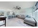 Open-concept living room and kitchen with gray sectional sofa and island at 1379 E Price Blvd, North Port, FL 34288